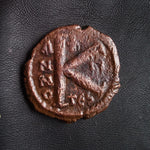 #o560# Byzantine 1/2 follis coin of Justin II from 565-578 AD